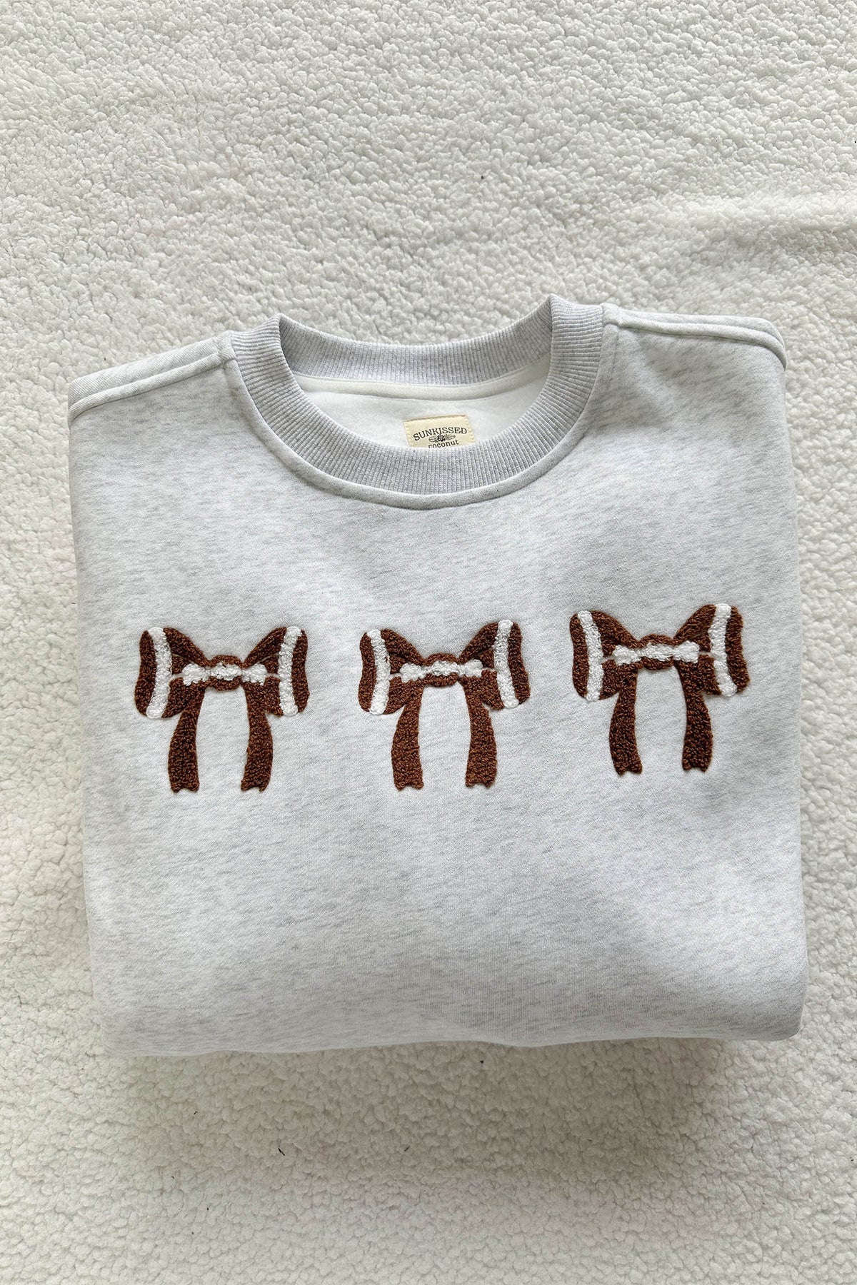 KaleaBoutique Comfortable Chenille Embroidered Rugby Bow Game Day Oversized Sweatshirt - KaleaBoutique.com