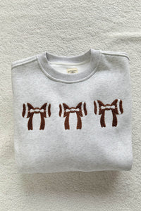 KaleaBoutique Comfortable Chenille Embroidered Rugby Bow Game Day Oversized Sweatshirt - KaleaBoutique.com