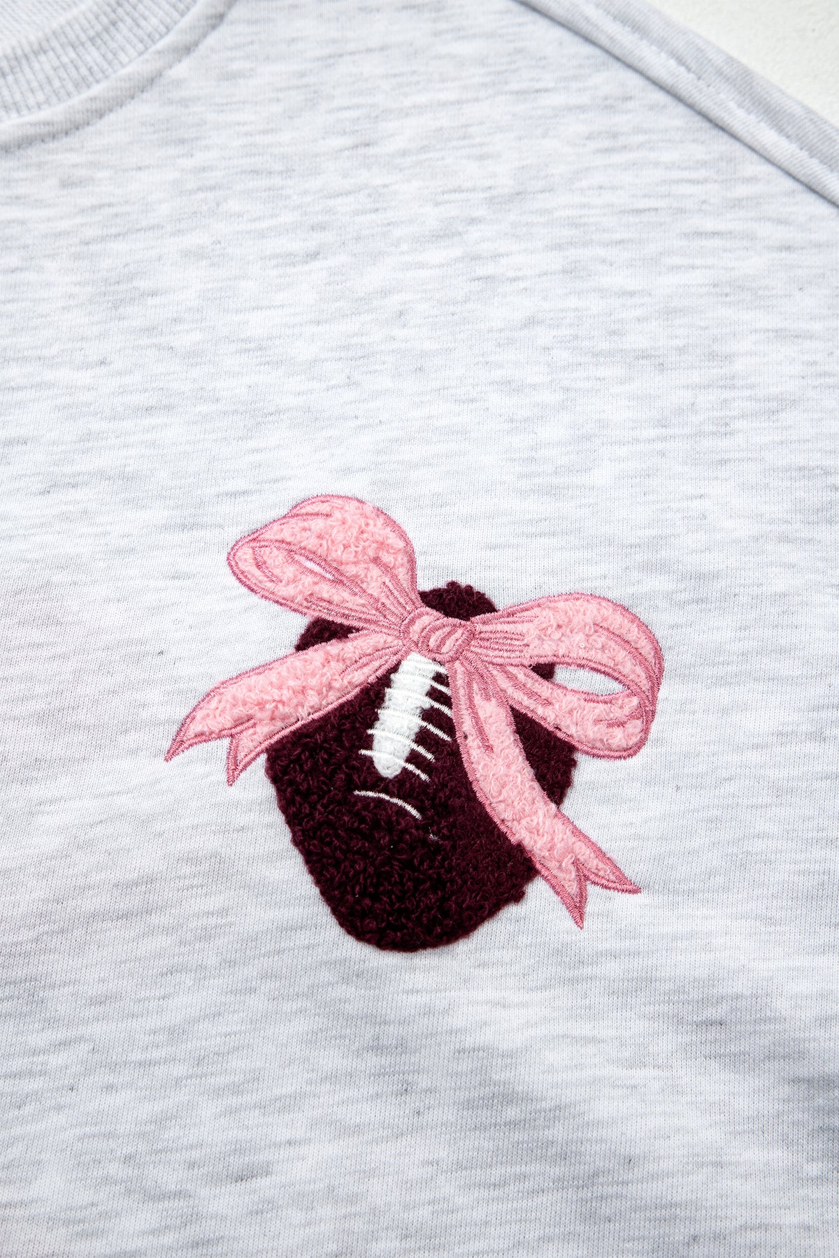KaleaBoutique Comfortable Embroidered Football Bow Back Long Sleeve Sweatshirt - KaleaBoutique.com