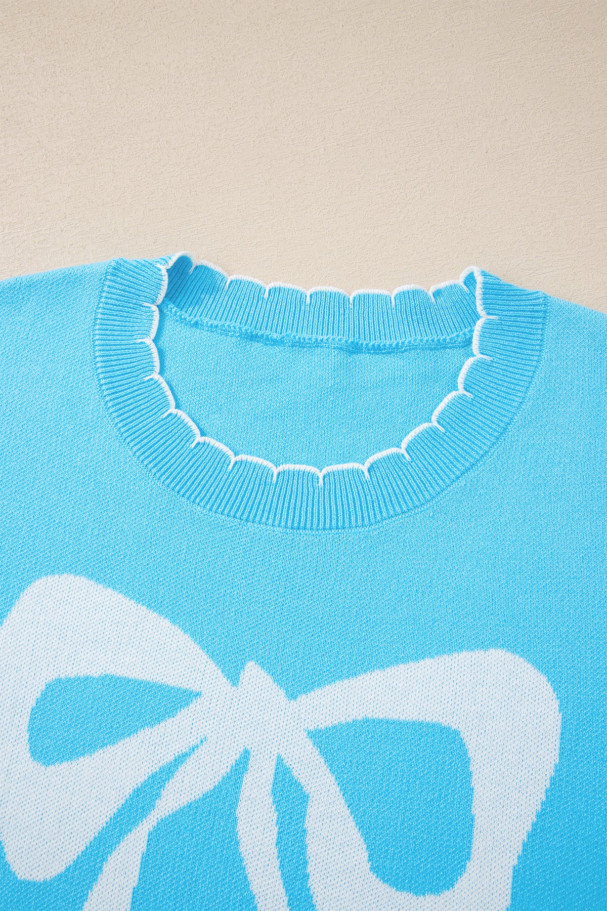 KaleaBoutique Comfortable Big Ribbon Bow Print Contrast Stitch Trim Drop Shoulder Sweater - KaleaBoutique.com