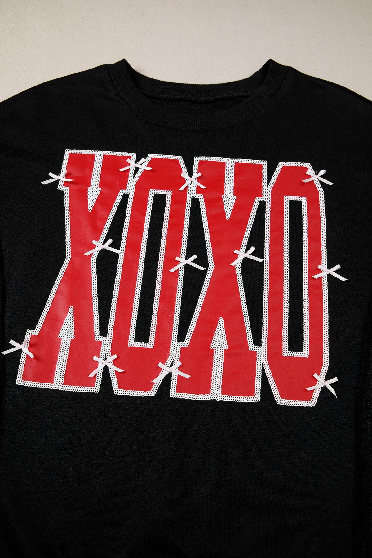 KaleaBoutique Stylish Bow Sequin XOXO Letter Graphic Exposed Seam Baggy Sweatshirt - KaleaBoutique.com
