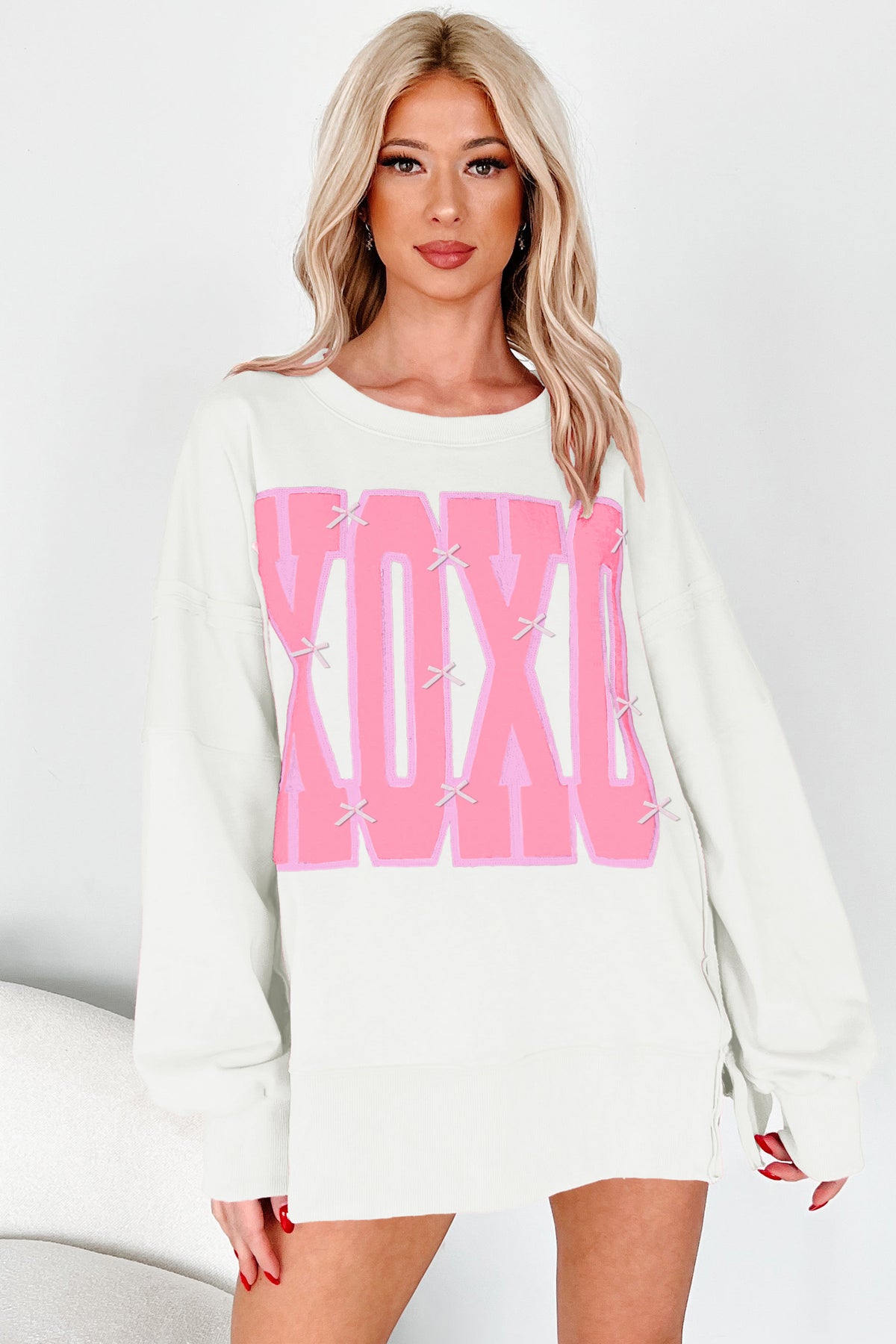 KaleaBoutique Stylish Bow Sequin XOXO Letter Graphic Exposed Seam Baggy Sweatshirt - KaleaBoutique.com