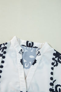 KaleaBoutique Stylish Abstract Printed Bell Sleeve Buttoned Tiered Babydoll Blouse - KaleaBoutique.com