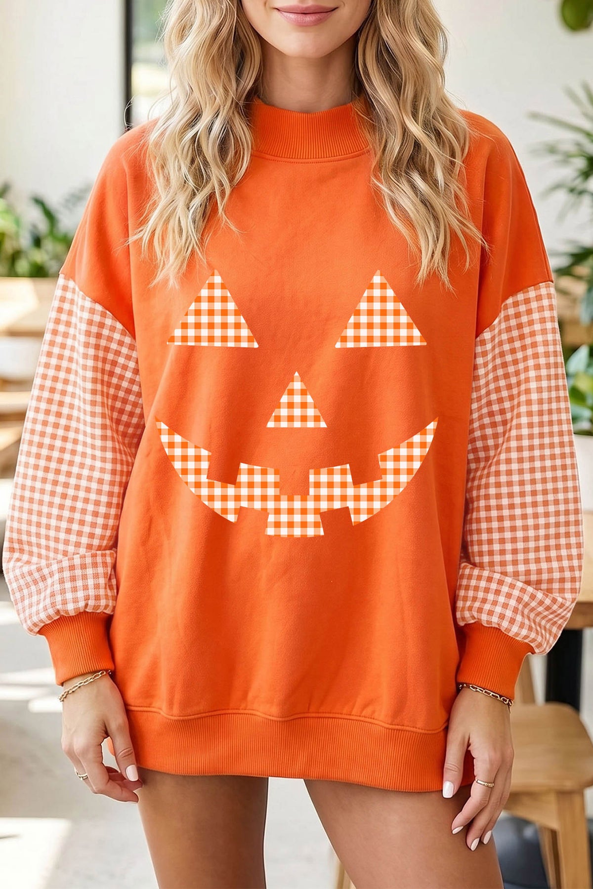 Russet Orange Pumpkin Face Halloween Sweatshirt with Plaid Sleeves - KaleaBoutique.com