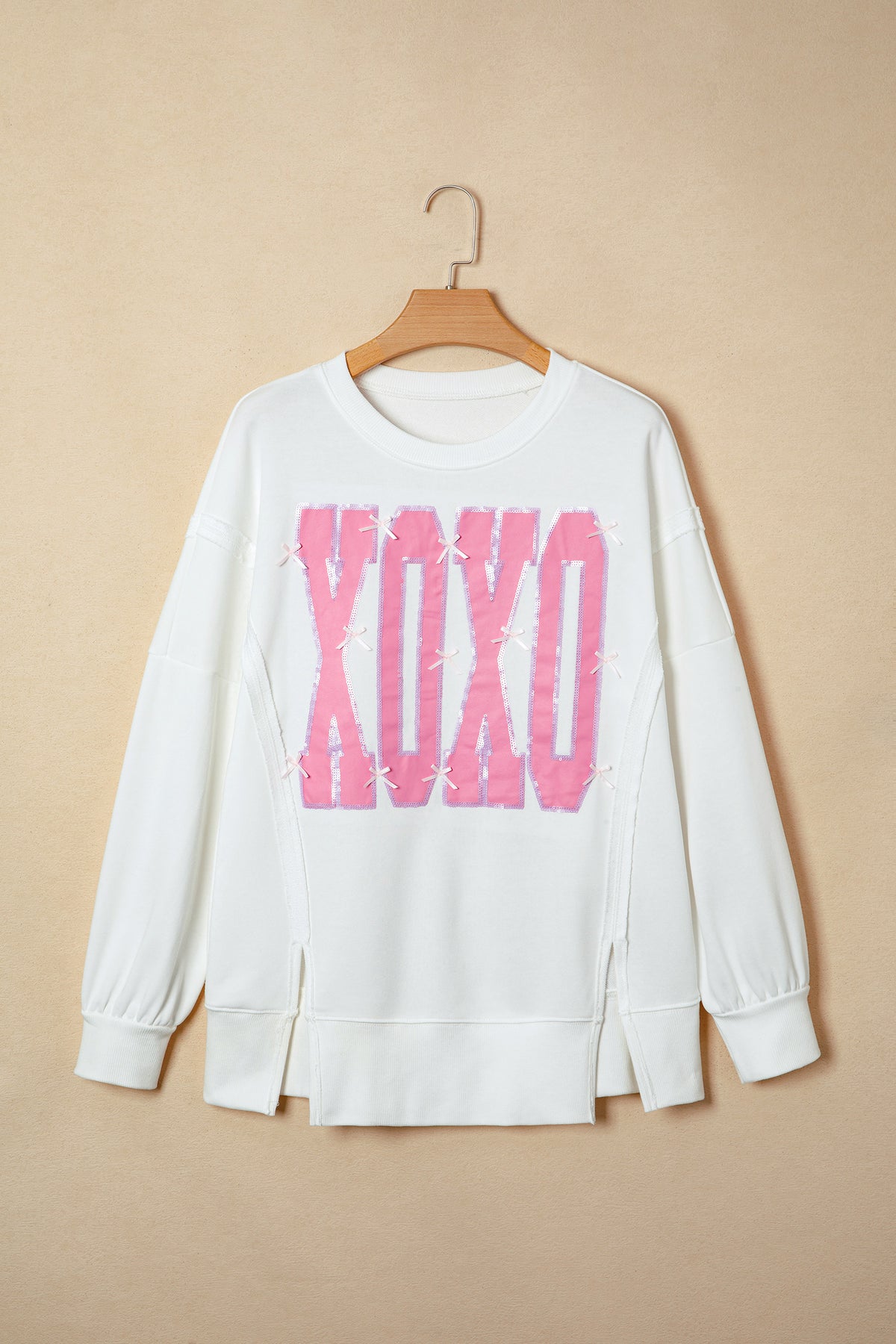 KaleaBoutique Stylish Bow Sequin XOXO Letter Graphic Exposed Seam Baggy Sweatshirt - KaleaBoutique.com