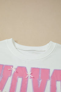 KaleaBoutique Stylish Bow Sequin XOXO Letter Graphic Exposed Seam Baggy Sweatshirt - KaleaBoutique.com