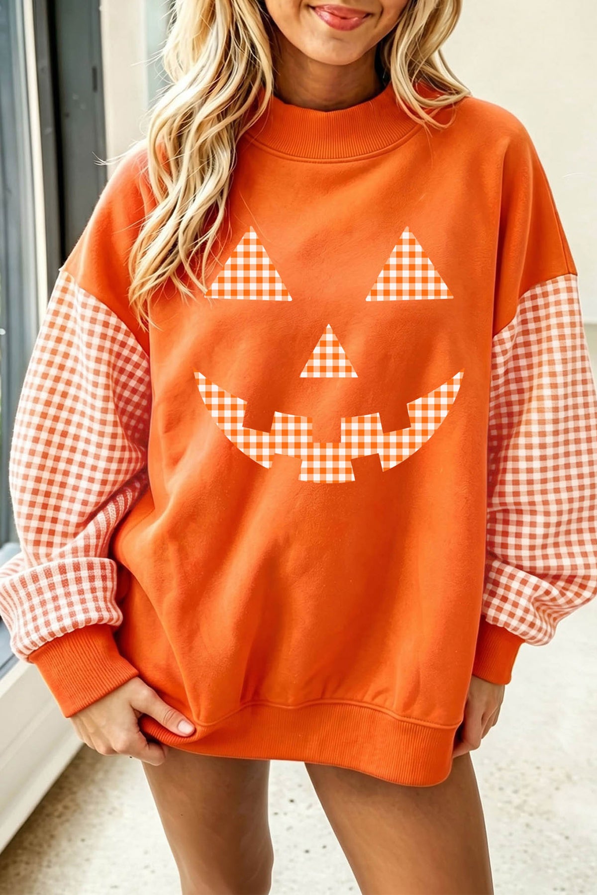 Russet Orange Pumpkin Face Halloween Sweatshirt with Plaid Sleeves - KaleaBoutique.com