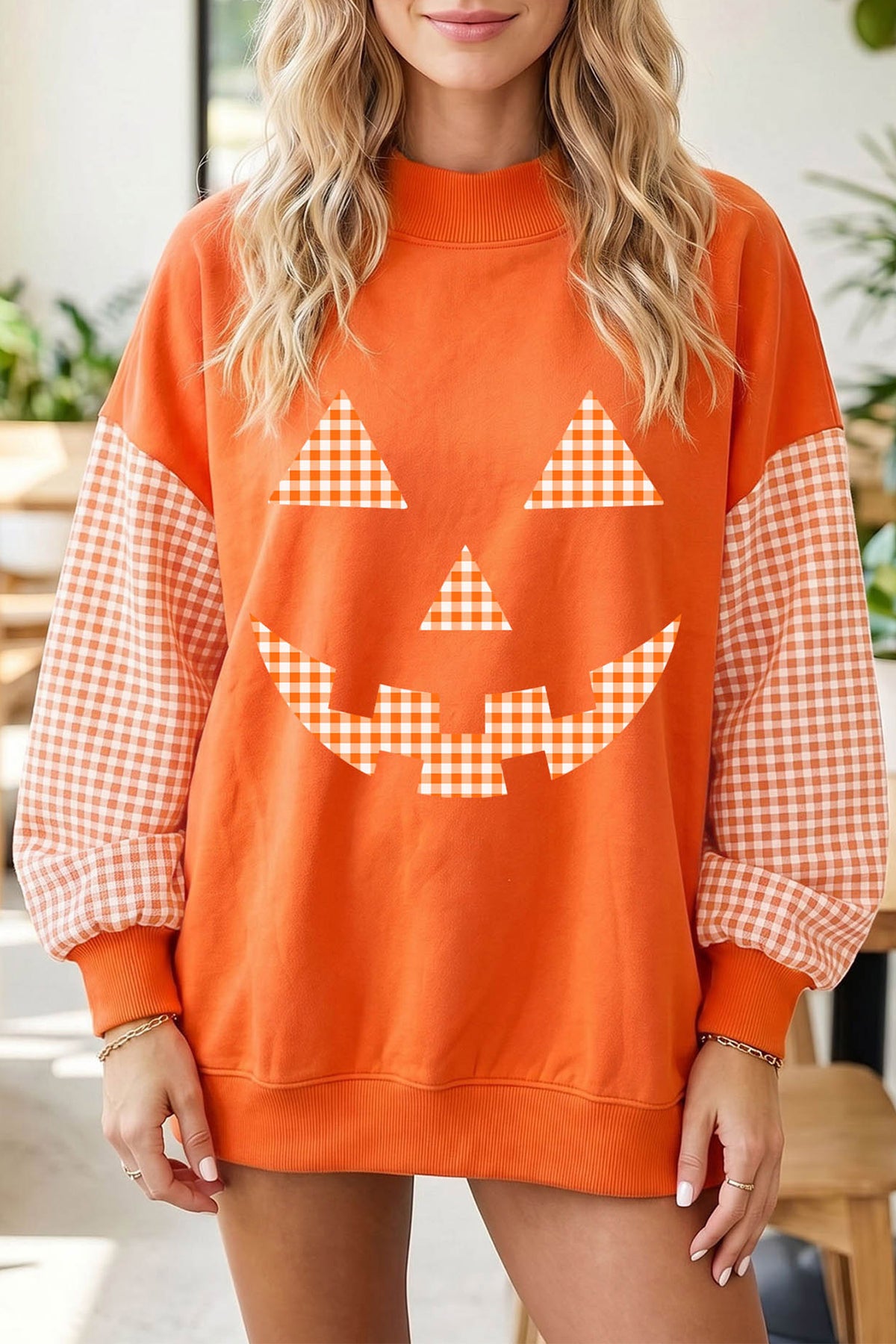 Russet Orange Pumpkin Face Halloween Sweatshirt with Plaid Sleeves - KaleaBoutique.com