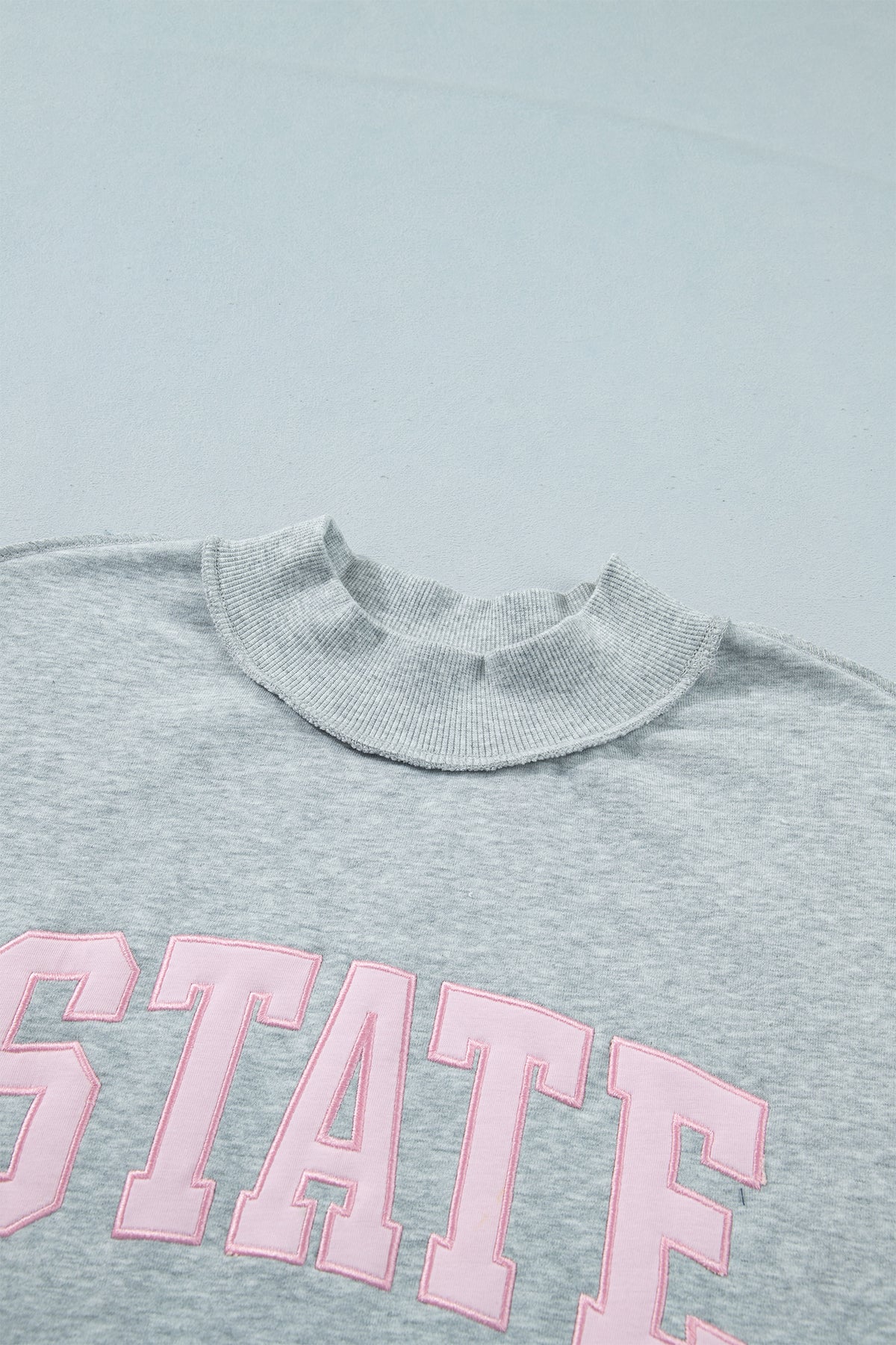 KaleaBoutique Comfortable Exposed Seam Mock Neck STATE Letter Graphic Loose Sweatshirt - KaleaBoutique.com
