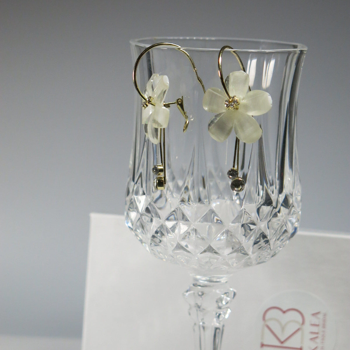 White Flower Dangle Crystal Charm Hoop Earrings, Omega Latch Back Gold Hoop Earrings with Removable Dangles - KaleaBoutique.com